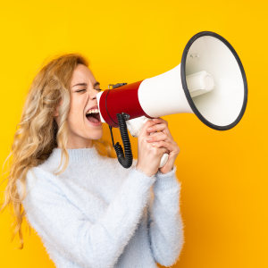 Woman yelling into a megaphone